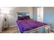 Cozy bedroom featuring a stylish bed frame and a purple velvet comforter set at 1100 Possum Trot Rd. # H234, North Myrtle Beach, SC 29582