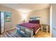 Cozy bedroom featuring wood-look flooring and a unique wood-slat headboard with matching side table at 1100 Possum Trot Rd. # H234, North Myrtle Beach, SC 29582