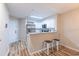 Modern kitchen features stainless appliances, white cabinets, and a breakfast bar with seating at 1100 Possum Trot Rd. # H234, North Myrtle Beach, SC 29582