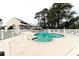 Community pool surrounded by lounge chairs and a gazebo, perfect for relaxation at 1100 Possum Trot Rd. # H234, North Myrtle Beach, SC 29582