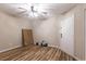 Unfurnished room with neutral walls, wood-look floors, and a ceiling fan, ready for customization at 1100 Possum Trot Rd. # H234, North Myrtle Beach, SC 29582