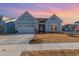 Craftsman style home with light blue siding, two-car garage, and landscaped lawn at 1204 Passante Ave., Myrtle Beach, SC 29572