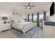 Spacious main bedroom with hardwood floors, plush bed, and large windows at 1204 Passante Ave., Myrtle Beach, SC 29572