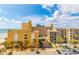 Lovely beach view featuring the complex, sandy beach, ocean, parking, and tropical landscaping at 1207 S Ocean Blvd. # 50707, Myrtle Beach, SC 29577