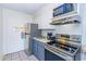 Compact kitchen with modern appliances and an open layout at 1207 S Ocean Blvd. # 50707, Myrtle Beach, SC 29577