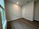 Comfortable bedroom with hardwood floors and natural light from the large window at 1305 Crested Iris Way, North Myrtle Beach, SC 29582