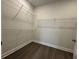 Spacious walk-in closet with modern shelving, perfect for organizing any wardrobe at 1305 Crested Iris Way, North Myrtle Beach, SC 29582