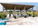 Outdoor lounge area with comfortable seating and shade, perfect for relaxation and socializing at 1305 Crested Iris Way, North Myrtle Beach, SC 29582