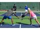 Active lifestyle: Pickleball court with players enjoying a competitive match, highlighting community recreation at 1305 Crested Iris Way, North Myrtle Beach, SC 29582