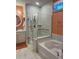 Bathroom features a glass shower, soaking tub, and double vanity with modern fixtures at 1310 Beautyberry Way, North Myrtle Beach, SC 29582