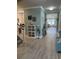 Inviting foyer with serene blue walls, light wood floors and a unique accent decor with staircase access to the left at 1310 Beautyberry Way, North Myrtle Beach, SC 29582