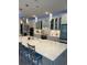 Modern kitchen with a large island, quartz countertops, pendant lighting, and ample cabinet space with blue trim at 1310 Beautyberry Way, North Myrtle Beach, SC 29582