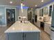 Spacious kitchen with quartz countertops, ample storage, and modern lighting fixtures at 1310 Beautyberry Way, North Myrtle Beach, SC 29582