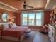 Tranquil main bedroom with water views, tray ceiling, and elegant furnishings at 1310 Beautyberry Way, North Myrtle Beach, SC 29582