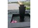 Charming backyard water feature with fire pit and playful pink flamingo floaties at 1310 Beautyberry Way, North Myrtle Beach, SC 29582