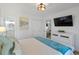 Bright bedroom with a king bed, white dresser, and a view to another room at 147 Anglers Dr., Murrells Inlet, SC 29576