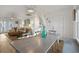 Dining area with farmhouse table and view into living room at 147 Anglers Dr., Murrells Inlet, SC 29576