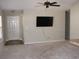 Living room with carpet, TV mount, and ceiling fan at 148 Junco Circle, Longs, SC 29568