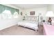 Spacious bedroom featuring a comfortable queen bed and wicker dresser at 1807 C Hillside Dr., North Myrtle Beach, SC 29582