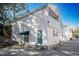 Rear view of house showcasing additional side entrance and small patio area at 1807 C Hillside Dr., North Myrtle Beach, SC 29582