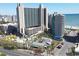 Aerial view of oceanfront resort, pool, playground, and parking at 201 74Th Ave. N # 701, Myrtle Beach, SC 29572