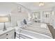 King size bed, dresser, and access to bathroom at 201 74Th Ave. N # 701, Myrtle Beach, SC 29572