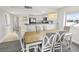 Dining area with wood table and chairs, adjacent to kitchen at 201 74Th Ave. N # 701, Myrtle Beach, SC 29572