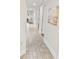 Bright hallway with tile flooring and neutral walls at 201 74Th Ave. N # 701, Myrtle Beach, SC 29572