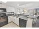 Modern kitchen with black appliances and granite countertops at 201 74Th Ave. N # 701, Myrtle Beach, SC 29572