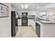 Modern kitchen with black appliances and granite countertops at 201 74Th Ave. N # 701, Myrtle Beach, SC 29572