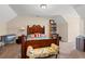 Cozy bedroom with a charming wooden bed frame and built-in shelving at 2024 Senator Gasque Rd., Marion, SC 29571