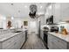 Modern kitchen with gray cabinets, granite countertops, and stainless steel appliances at 2305 Ameron Ct., North Myrtle Beach, SC 29582