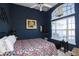 Spacious bedroom with floral bedding, large window, and ceiling fan at 265 Encore Circle, Myrtle Beach, SC 29579