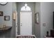 Bright entryway with a white door, arch window, and gray walls at 265 Encore Circle, Myrtle Beach, SC 29579