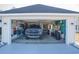 Attached garage with Ford truck and various storage at 265 Encore Circle, Myrtle Beach, SC 29579