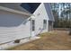 White house exterior with landscaping and back door at 265 Encore Circle, Myrtle Beach, SC 29579