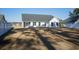 White house exterior with gray roof and screened porch at 265 Encore Circle, Myrtle Beach, SC 29579
