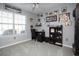 Home office with built-in shelving, desk, and window with blinds at 265 Encore Circle, Myrtle Beach, SC 29579