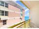 Balcony overlooking ocean showcasing building's exterior facade and a white plastic chair at 2701 S Ocean Blvd. # 1711, North Myrtle Beach, SC 29582