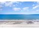 Ocean view showing waves washing on the beach on a sunny day with blue skies at 2701 S Ocean Blvd. # 1711, North Myrtle Beach, SC 29582