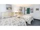 Comfortable bedroom with two beds, neutral decor, and unique sea-themed artwork at 2701 S Ocean Blvd. # 1711, North Myrtle Beach, SC 29582