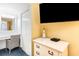 Bedroom featuring vanity area, closet, dresser with TV, and decorative lighthouse at 2701 S Ocean Blvd. # 1711, North Myrtle Beach, SC 29582