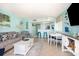 Open-concept living space with a kitchen bar, dining area, and cozy seating arrangement for relaxation at 2701 S Ocean Blvd. # 1711, North Myrtle Beach, SC 29582