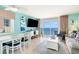 Bright living room with ocean view through glass doors and comfortable seating arrangement at 2701 S Ocean Blvd. # 1711, North Myrtle Beach, SC 29582