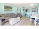 Bright living room featuring a kitchen bar, dining area, and comfortable seating, creating an inviting space at 2701 S Ocean Blvd. # 1711, North Myrtle Beach, SC 29582