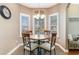 Bright breakfast nook with a round table and four chairs, perfect for casual dining at 278 Seagrass Loop, Myrtle Beach, SC 29588