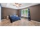 Spacious bedroom with ceiling fan and large window at 3348 Merganser Dr., Conway, SC 29527