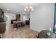 Bright dining area with chandelier and view of kitchen at 3348 Merganser Dr., Conway, SC 29527
