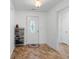 Bright entryway with tiled floor, door, and shoe rack at 3348 Merganser Dr., Conway, SC 29527