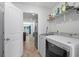 Laundry room with washer, dryer, and additional storage shelves at 3348 Merganser Dr., Conway, SC 29527